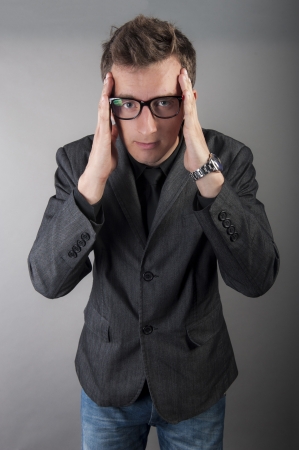 an image of young businessman with headache の写真素材