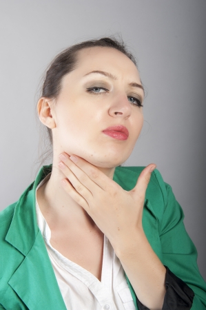 an image of businesswoman with sore throatの写真素材