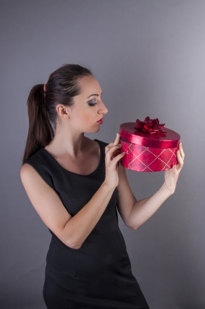 an image girl holding red gift boxの写真素材