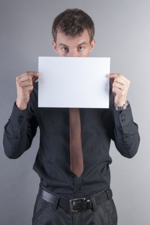 an image of young handsome businessman with blank cardの写真素材