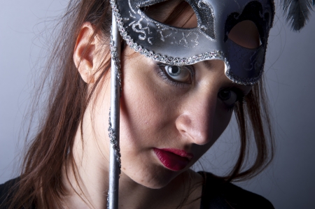 an image of beautiful young girl with venetian maskの写真素材