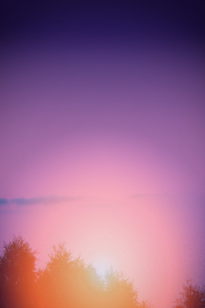 An image of sunset with sun raysの写真素材