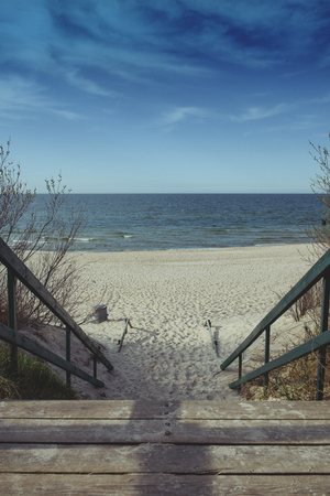 walkpath to the beach made with wood and reeds.の写真素材