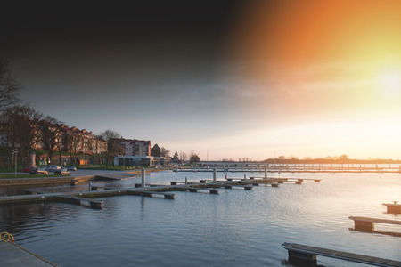 Yacht port over beautiful orange sunset in summer timeの写真素材