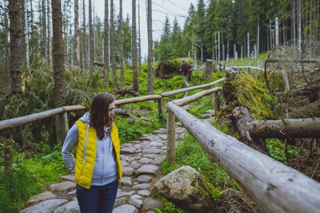 brunette woman hiker hiking on trail in summer time. Tatra mountain in Poland.の写真素材