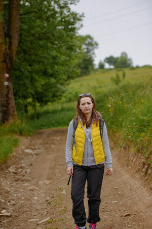brunette woman hiker hiking on trail in summer time. Tatra mountain in Poland.の写真素材