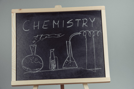 Blackboard with the chemical formula, gray backgroundの写真素材