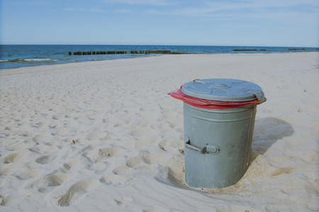 garbage can at the beach over Baltic Seaの写真素材