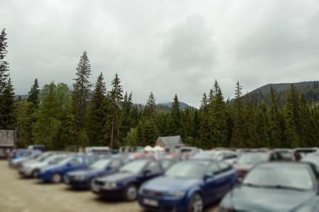 Aerial parking lot outdoors vehicles green park.の写真素材