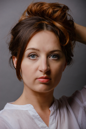 young beautiful brunette woman portrait in studioの写真素材