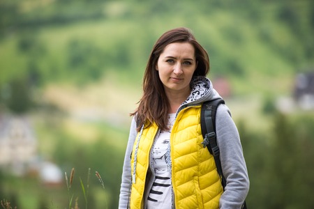 brunette woman hiker hiking on trail in summer time. Tatra mountain in Poland.の写真素材