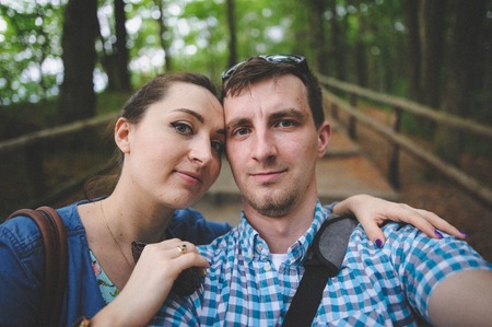 Couple taking selfie photo in the parkの写真素材