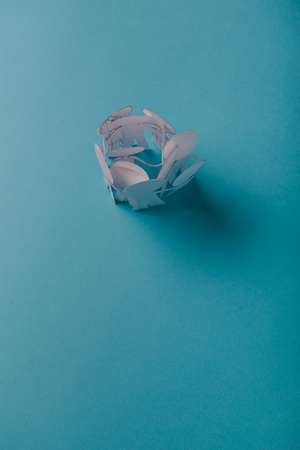 abstract paper people holding for hands on blue backgroundの写真素材