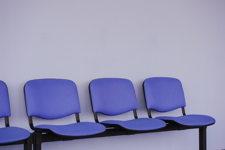 Waiting room,chairs against a gray wallの写真素材