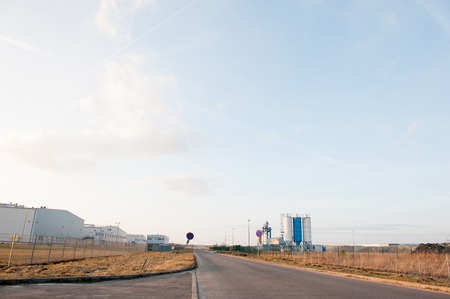 Modern industrial exterior building over blue sky
