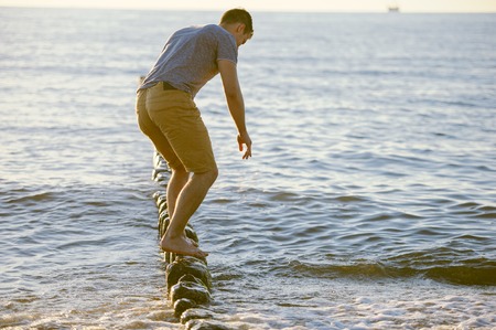 People walking on the beach in the ocean. Summer timeの写真素材