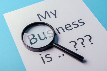 My business is word concept. Business word with business document paper on blue background. For...