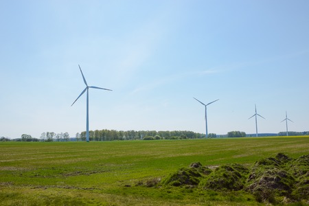 Bright blue sky moving and wind turbine.の写真素材