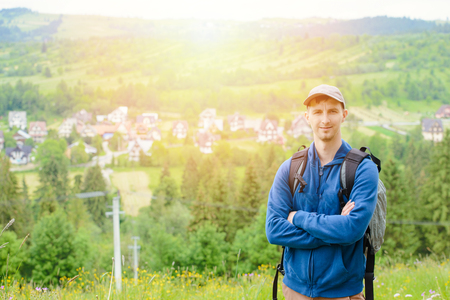 Traveler Man with backpack mountaineering Travel Lifestyle concept rocky mountains on background adventure vacations outdoorの写真素材