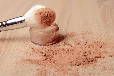 close up of a make up powder and a brush. makeup brush with powder foundationの写真素材