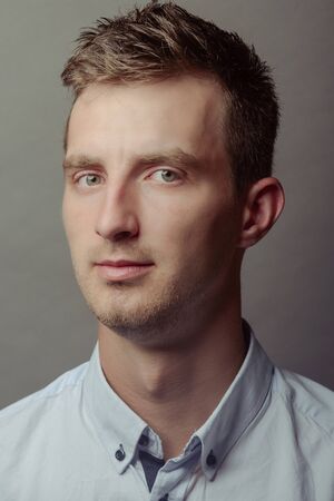 Portrait of a smart serious young man.