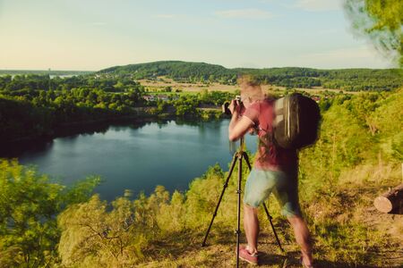 Photographer's boyfriend takes a photo. Summer season. Nature and landscape photographyの写真素材