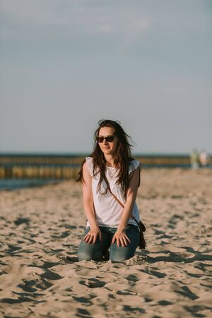 Portrait of smiling young woman enjoying the time.の写真素材