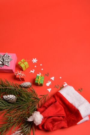 Christmas or New Year background, plain composition made of Xmas decorations and fir branches, flat lay, blank space for a greeting text.の写真素材