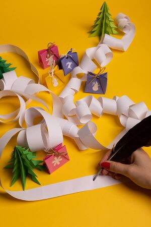 Long twisted expanded letter for Santa Claus. Copy space. yellow backgroundの写真素材