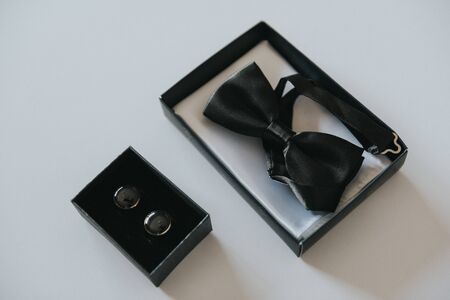 Groom's wedding accessories. Bow tie, suit, cufflinks, belt and shoesの写真素材