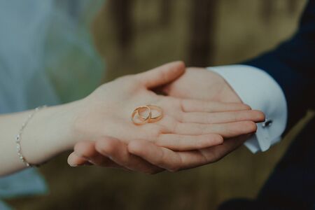 Beautiful two golden wedding rings. Made of highest quality materialの写真素材