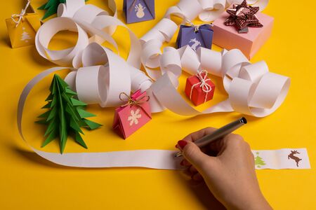 Long twisted expanded letter for Santa Claus. Copy space. yellow backgroundの写真素材
