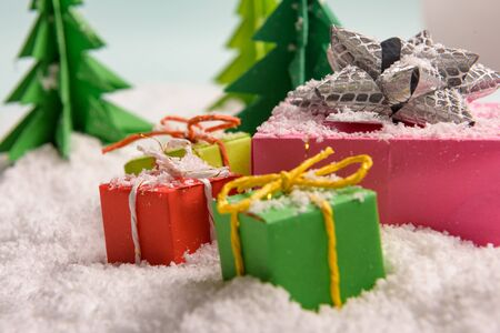christmas presents nicely decorated with bows and feathers. view from aboveの写真素材