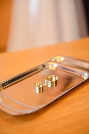 Beautiful two golden wedding rings. Made of highest quality materialの写真素材