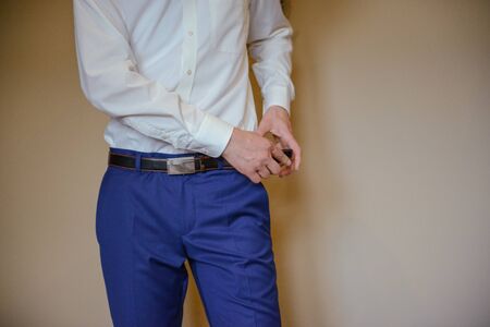 Groom's wedding accessories. Bow tie, suit, cufflinks, belt and shoesの写真素材