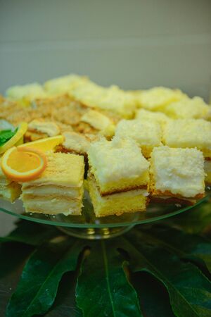 Delicious sweets on candy buffet. Wedding bakes on trays.の写真素材
