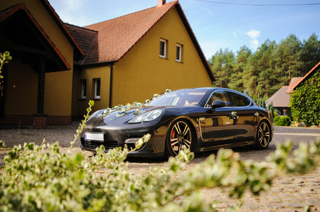 Luxury wedding car decorated with beautiful flowers. Brides and grooms wedding dayのeditorial素材