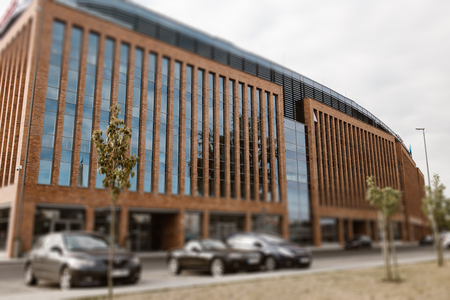 Office building with motion blurred clouds, business concept. Office building in Szczecin, Poland.のeditorial素材