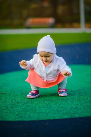 Little girl spending fantastic time on playground. Happy childhood.の写真素材