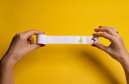 Long twisted expanded empty letter. Copy space. yellow background. View from aboveの写真素材