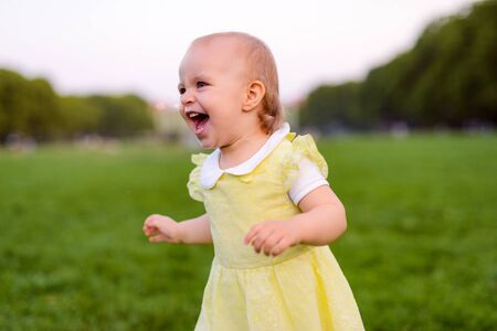 Smiling girl in the park in summer time. Authentic lifestyle imageの写真素材