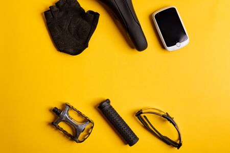 Bicycle, Cycling accessories on the yellow background. view from aboveの写真素材