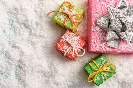 christmas presents nicely decorated with bows and feathers. view from aboveの写真素材