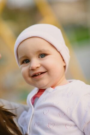 Adorable girl having fun on beautiful autumn day.の写真素材