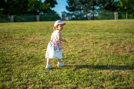 Smiling girl in the park in summer time. Authentic lifestyle imageの写真素材
