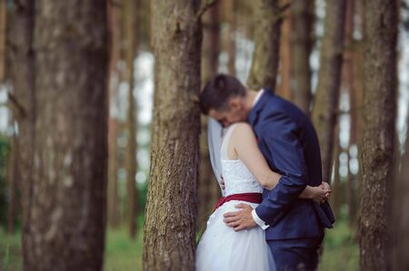 Bride and groom at a photo session in the nature.の写真素材