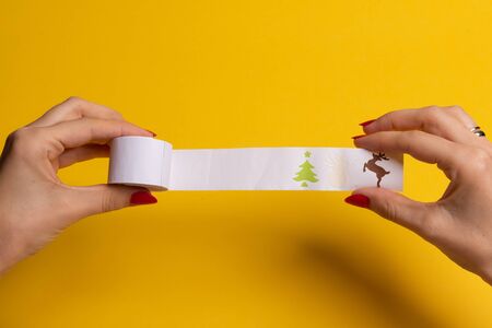 Long twisted expanded empty letter. Copy space. yellow background. View from aboveの写真素材