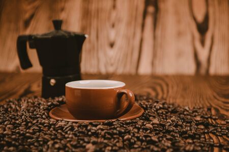 Coffee cup and beans on a backgroundの写真素材