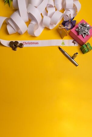 Long twisted expanded empty letter. Copy space. yellow background. View from aboveの写真素材