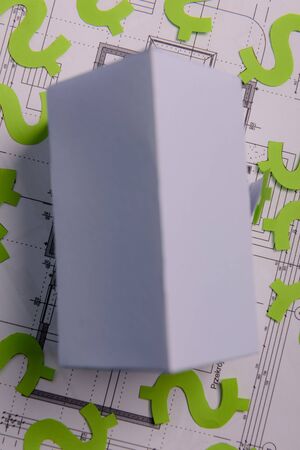 Paper skyscrapers , us dollar money, house projects plan and blueprints on blue background paper. Minimalistic and simple concept, style. Horizontal orientation. View from above. Copy space.の写真素材